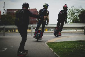 Rider balancing on an electric unicycle, demonstrating its ease of use and versatility