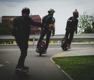 Rider balancing on an electric unicycle, demonstrating its ease of use and versatility